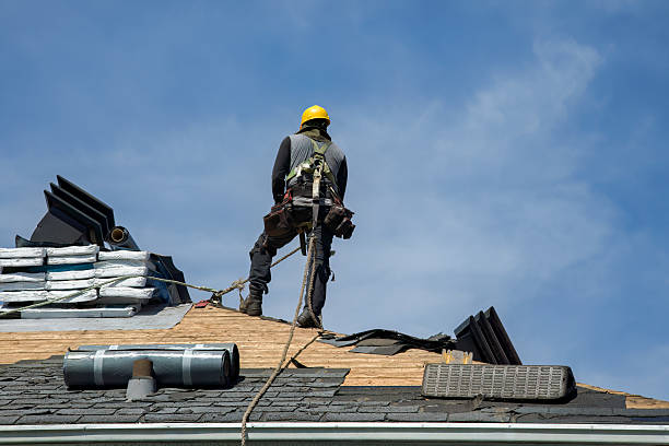 Professional Roof Replacement technician working in Coram, MT